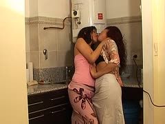 Two exotic girls kiss in the employees' kitchen
